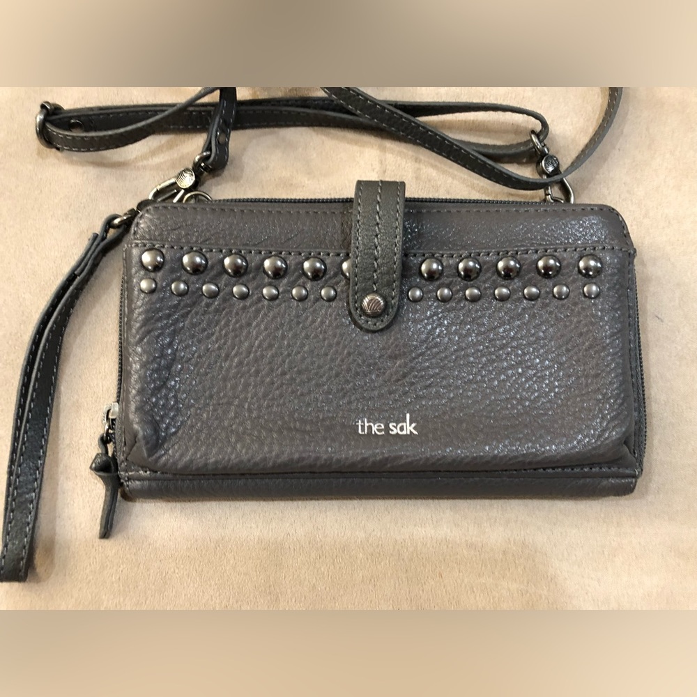 The Sak grey wristlet with shoulder strap